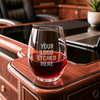 Unique branded wine glass filled with red wine in a luxury lounge setting – great for business gifting, custom glassware, or high-end promotional items.