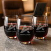 Set of three custom etched stemless wine glasses with company logos – perfect for bulk corporate gifts, executive meetings, or team appreciation packages.